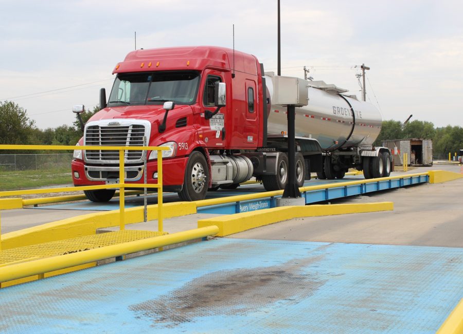  What specific roles do truck scales play in ensuring road safety and regulation compliance?